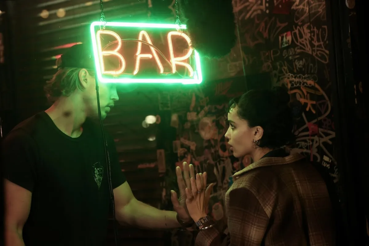 Actors Austin Butler and Zoe Kravitz film a scene for Caught Stealing in an NYC bar