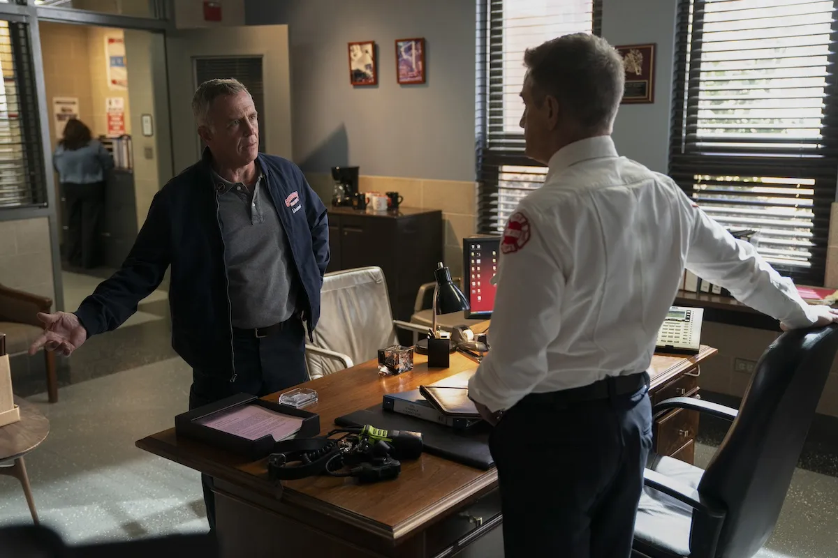 Two man talking to each other from across a desk in 'Chicago Fire'