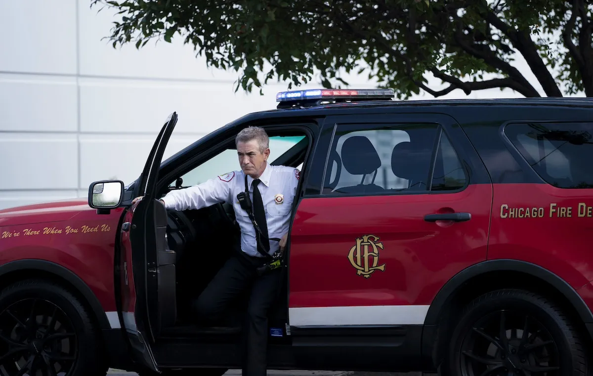 Man getting out of a Chicago Fire Department SUV