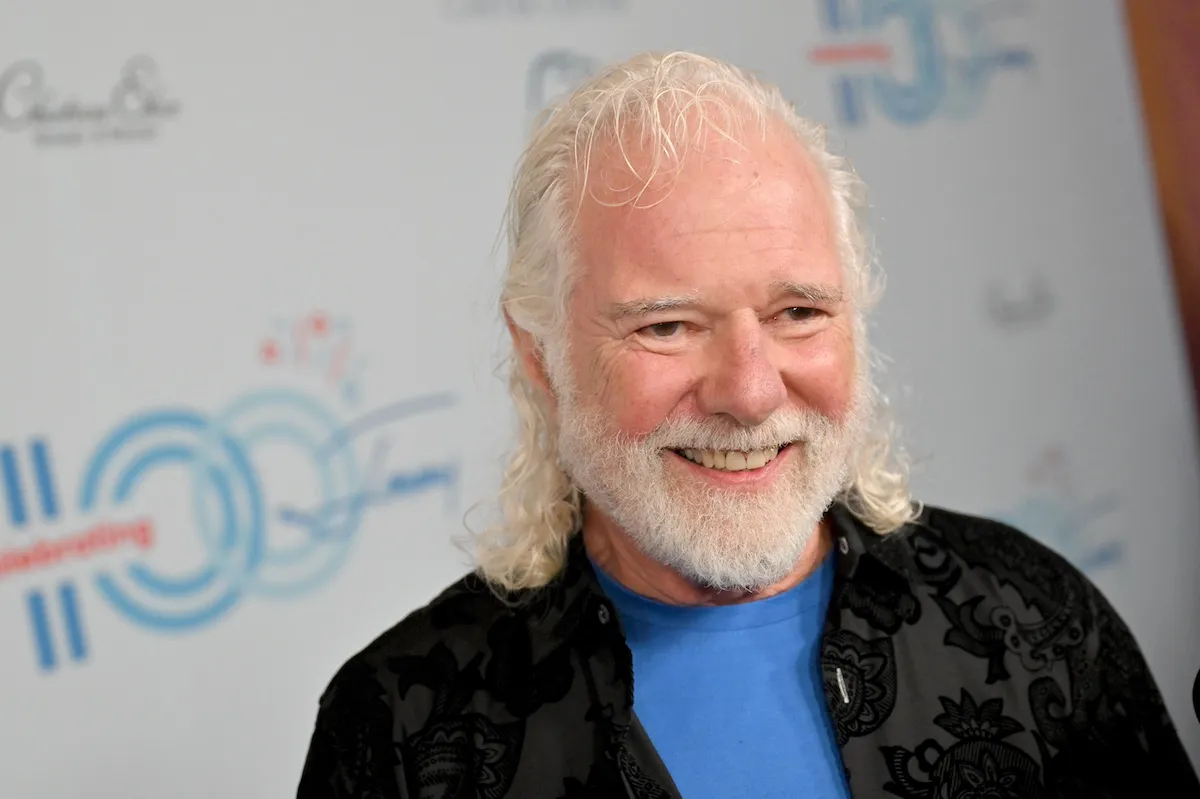 Chuck Leavell in a black jacket and blue t-shirt