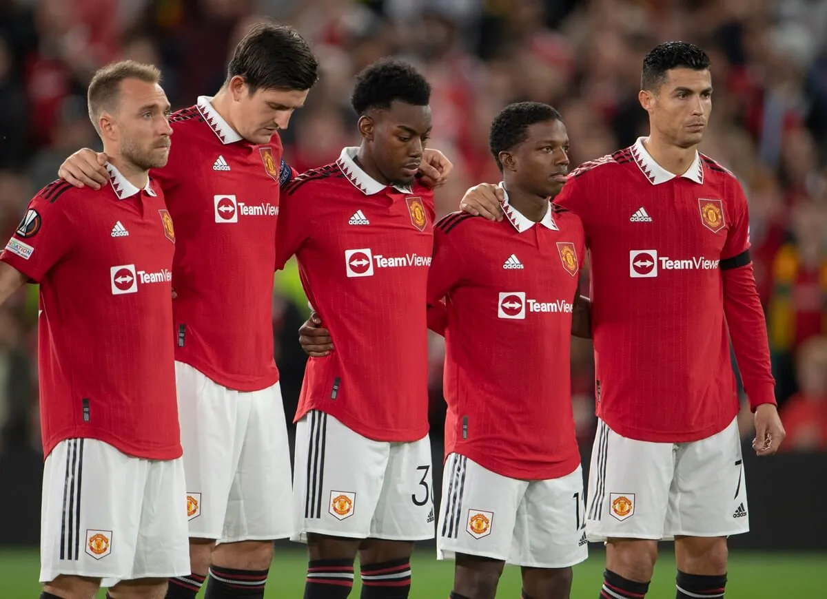 Cristiano Ronaldo and his Manchester United teammates observe a moment of silence following the death of Queen Elizabeth II before the UEFA Europa League group E match