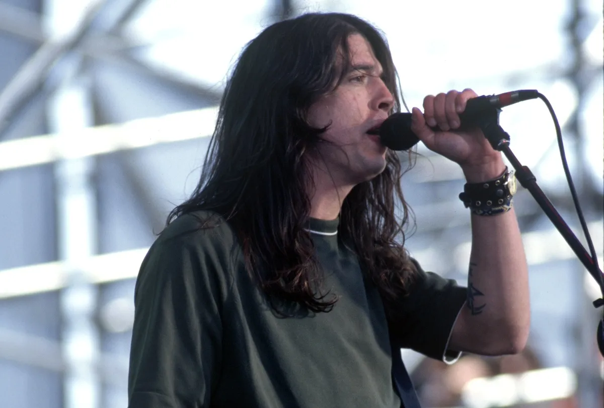 Dave Grohl singing into a microphone