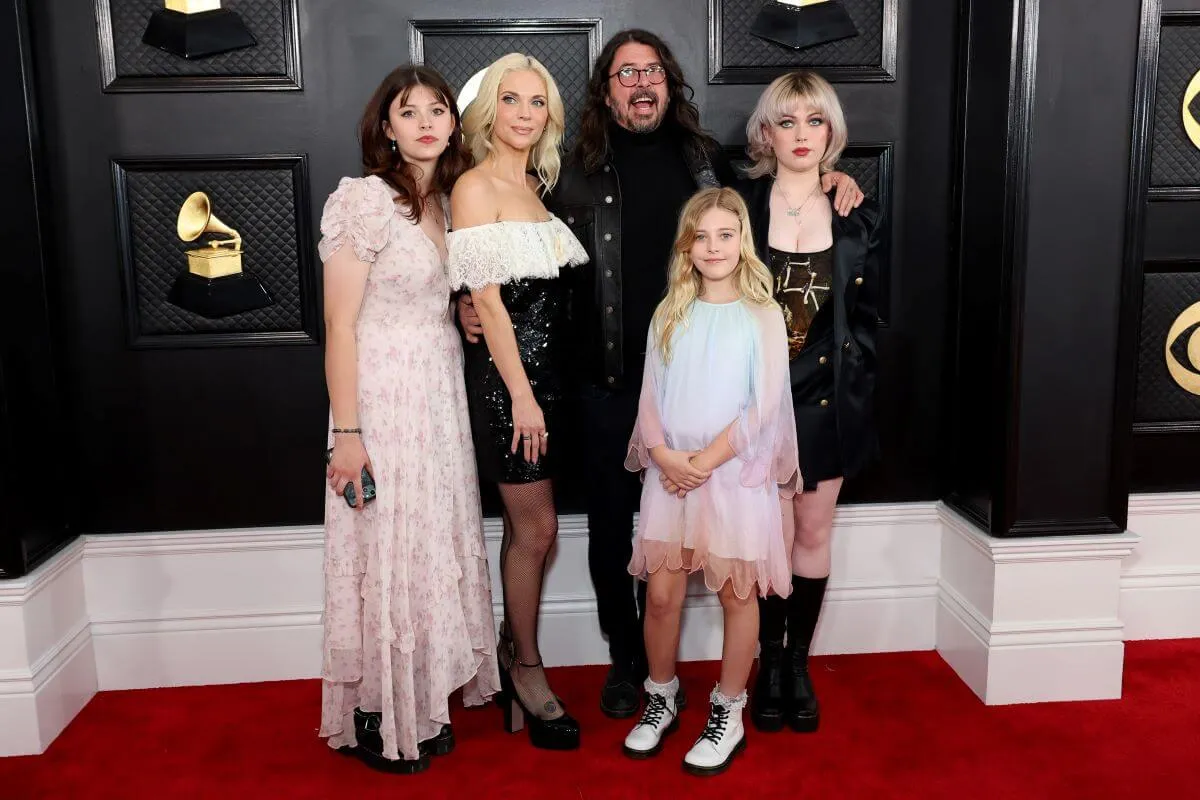  Harper Grohl, Jordyn Blum, Dave Grohl, Ophelia Grohl, and Violet Grohl stand together at the Grammys. 