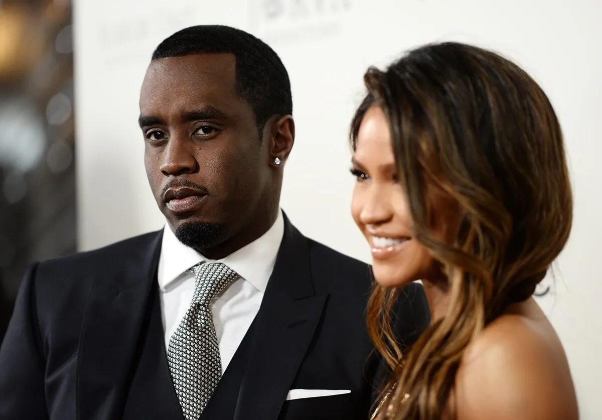 Diddy in a suit posing next to Cassie at the premiere of Lionsgate's "The Perfect Match".