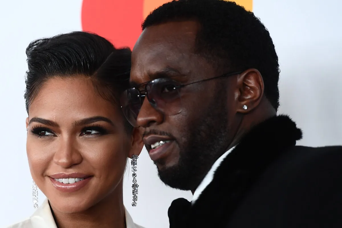 Diddy and Cassie posing at the traditional Clive Davis party on the eve of the 60th Annual Grammy Awards.