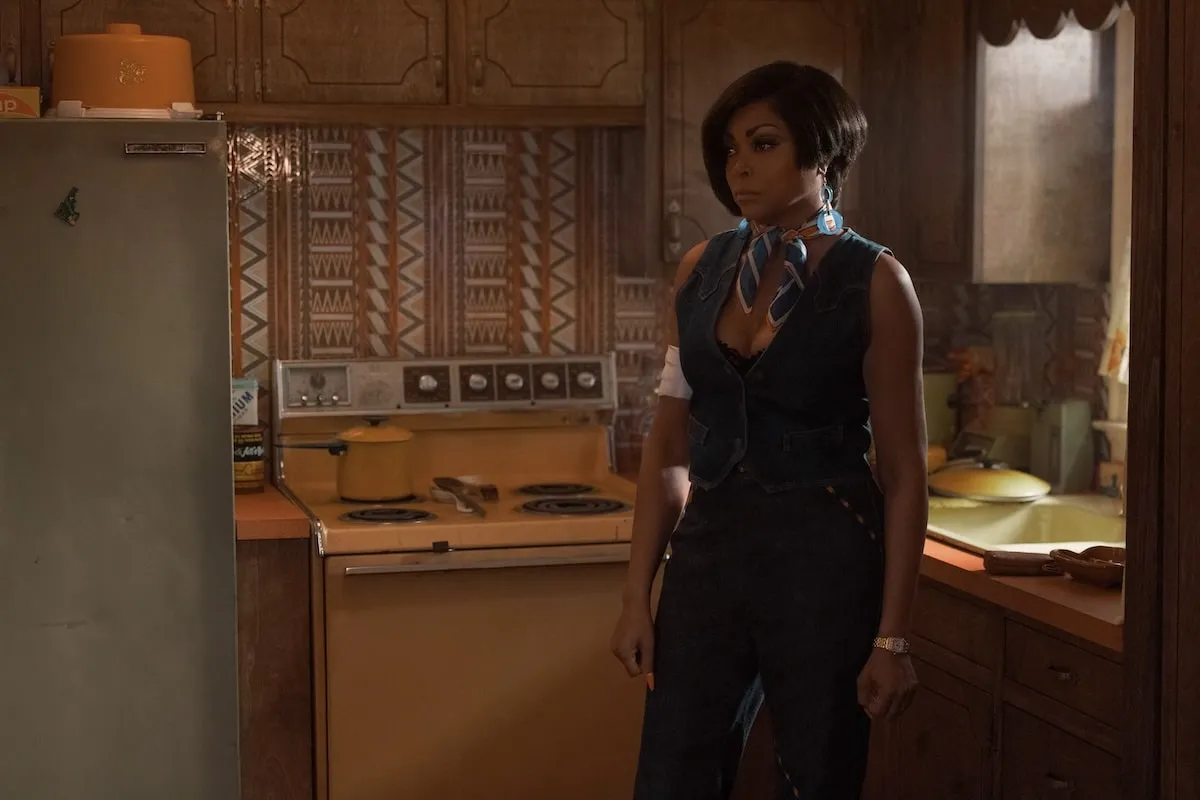 Wearing a jean vest and denim pants, Taraji P. Henson films a scene carpet for Peacock's Fight Night: The Million Dollar Heist