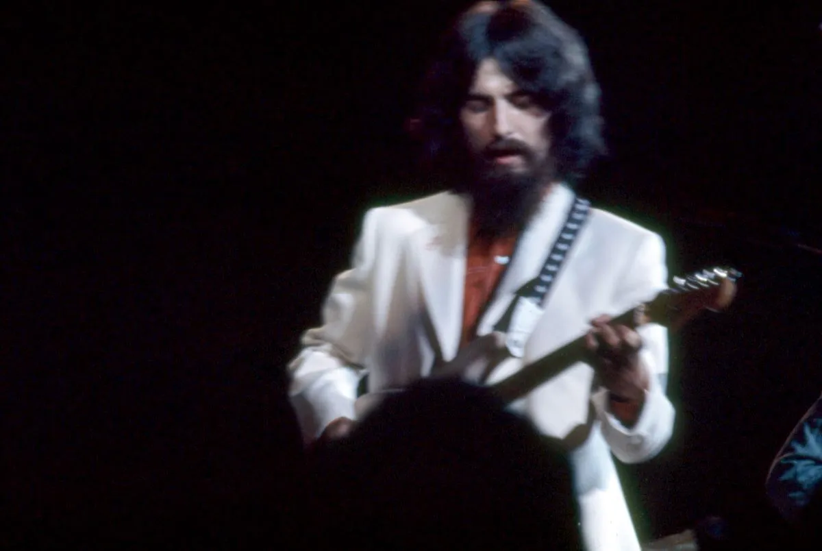 George Harrison plays guitar during the Concert for Bangladesh.