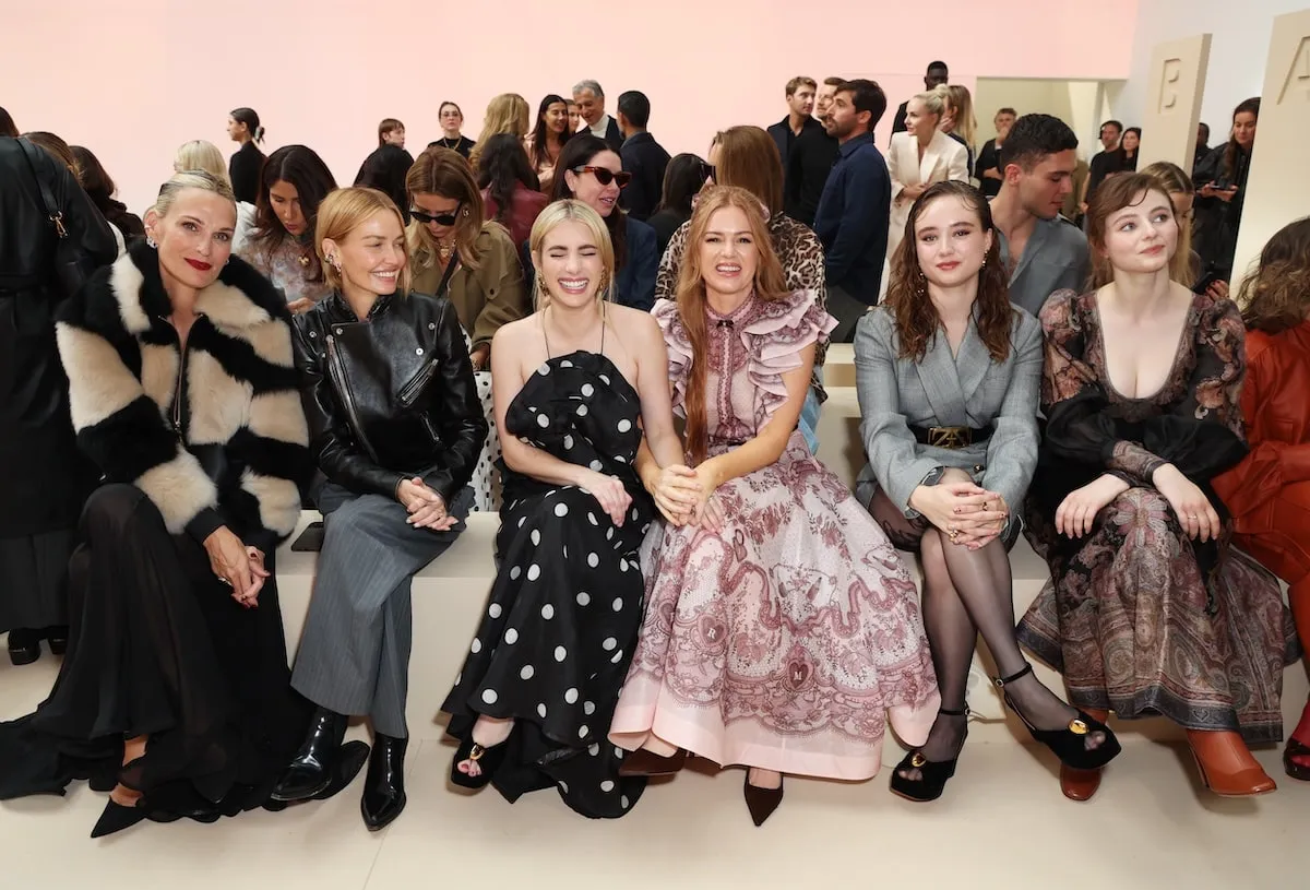 Celebrities Molly Sims, Lara Worthington, Emma Roberts, Isla Fisher, Ruby Stokes, and Thomasin Harcourt McKenzie smile and sit front at the Zimmermann show