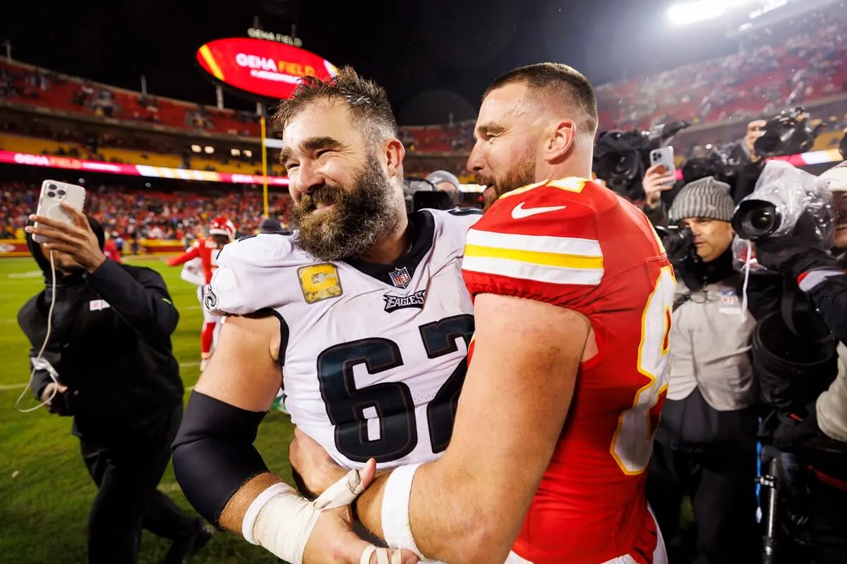 Jason Kelce and Travis Kelce embrace after a game