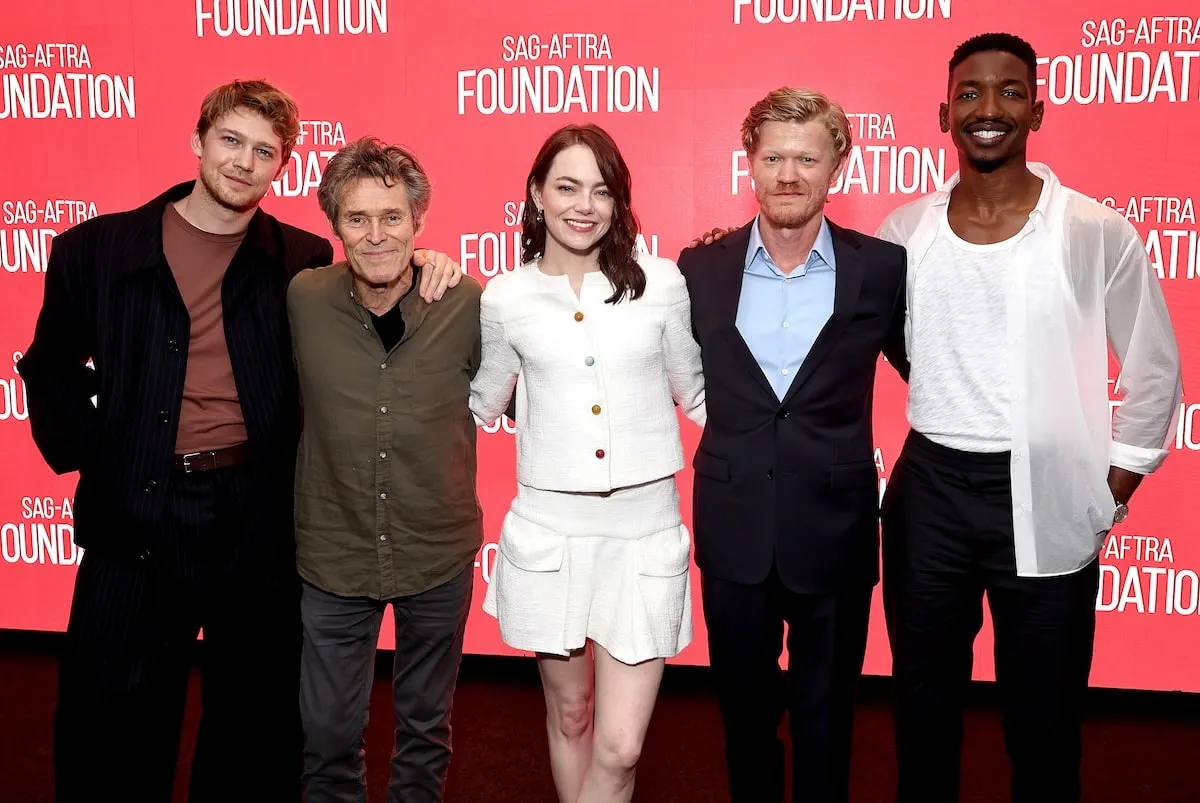 The Kinds of Kindness cast gathers together for a cast photo in 2024