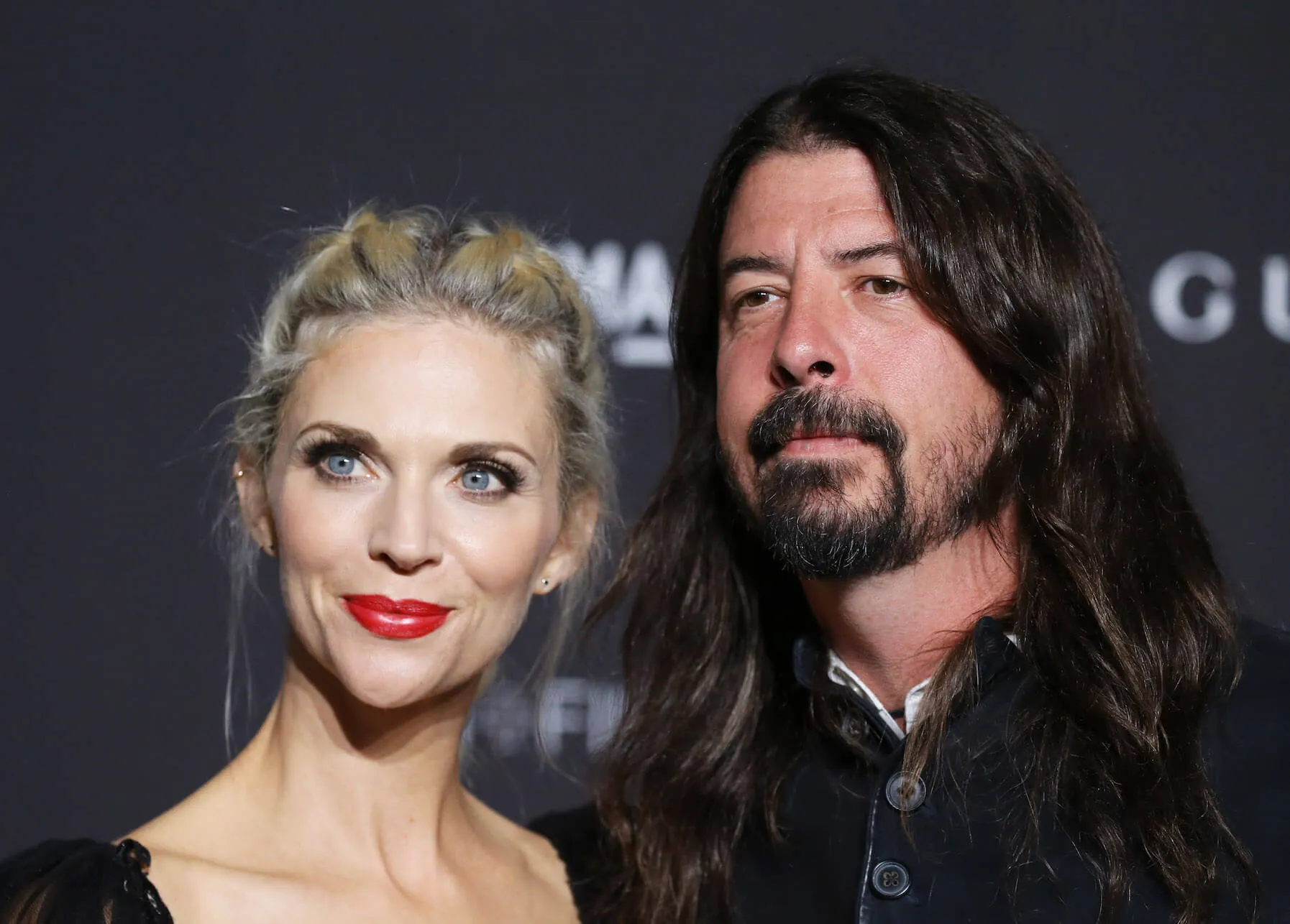 A close-up of Jordyn Blum and Dave Grohl posing next to each other at an event in 2018