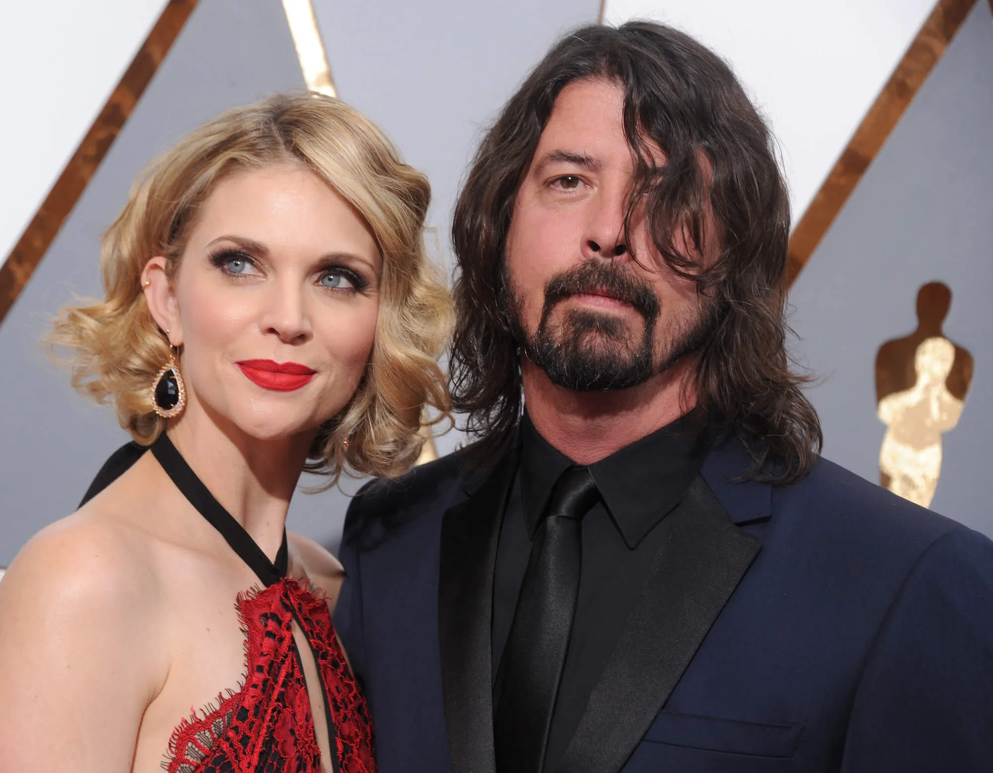 Jordyn Blum and Dave Grohl standing side by side at the Academy Awards in 2016