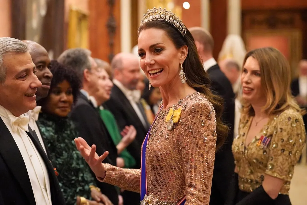 Kate Middleton meets with guests during a reception for members of the Diplomatic Corps at Buckingham Palace