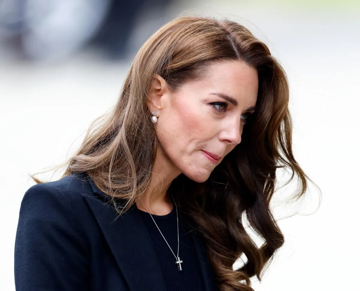 Kate Middleton views floral tributes to the late Queen Elizabeth II left at the entrance to Sandringham House