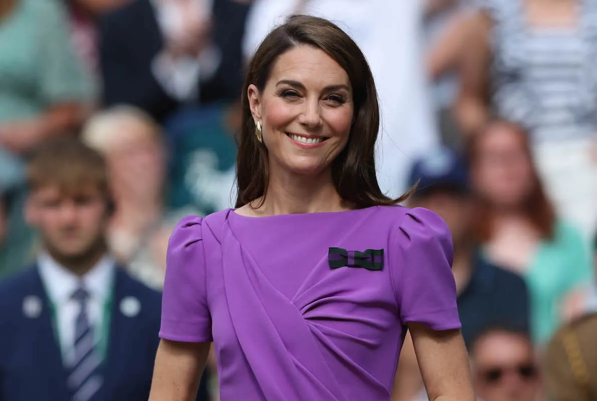 Kate Middleton, who will 'rest quietly' as Prince George, Princess Charlotte, and Prince Louis go back to school, smiles wearing a purple dress.