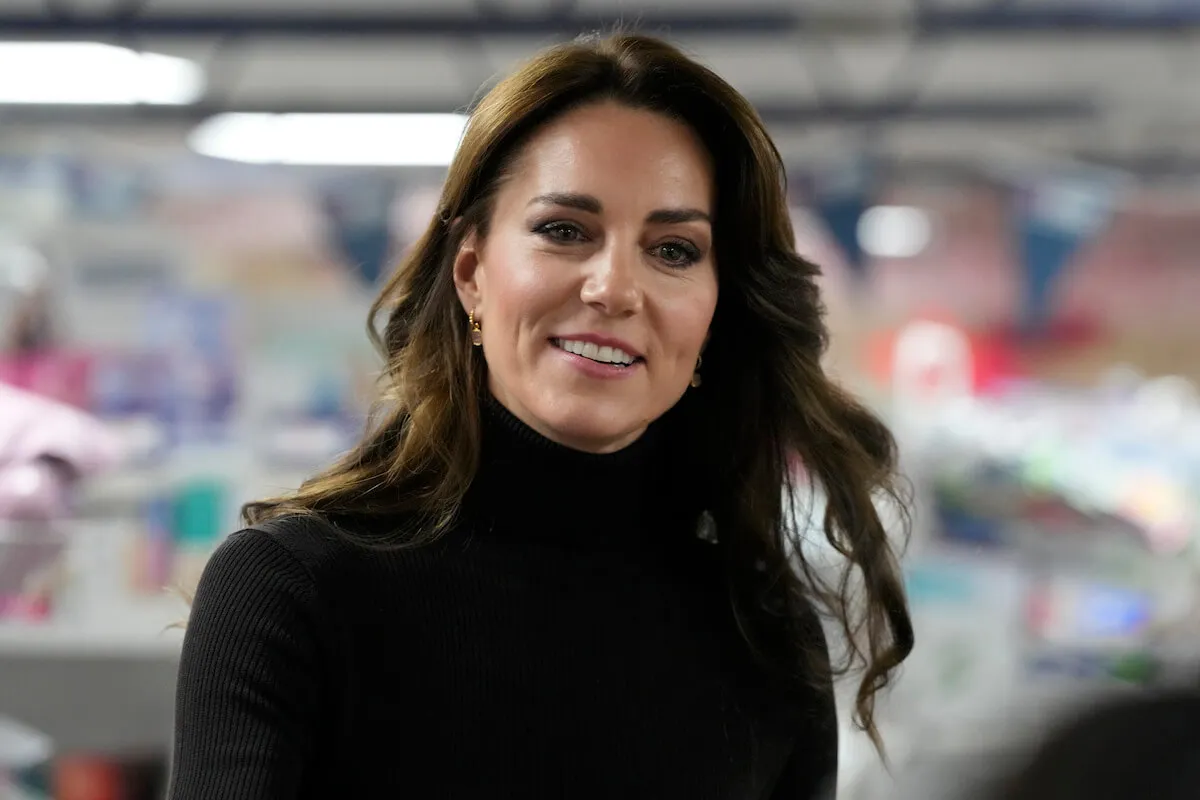 Kate Middleton, whose cancer update video is expected to feature on TikTok for years, looks on wearing a black turtleneck