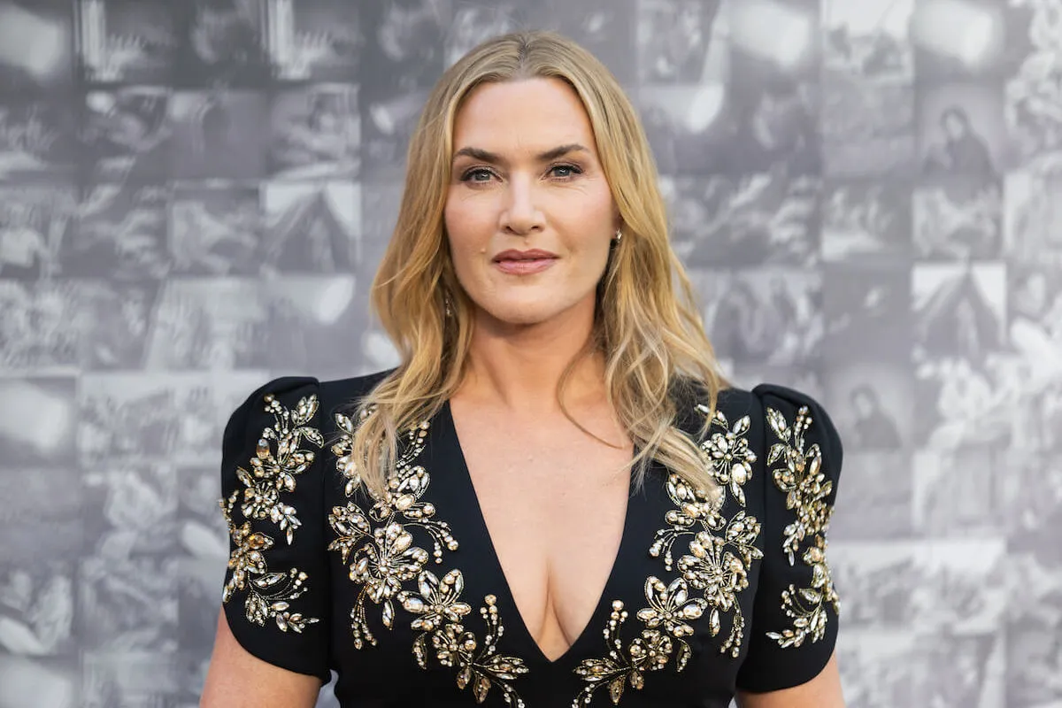 Kate Winslet, who underwent testosterone replacement therapy, at the 'Lee' UK premiere wearing a black and gold dress.