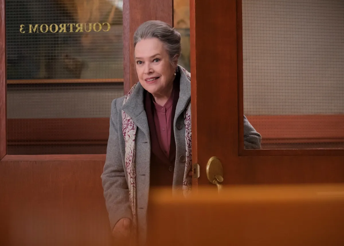 Kathy Bates as Madeline ' Matty' Matlock peeking through a door