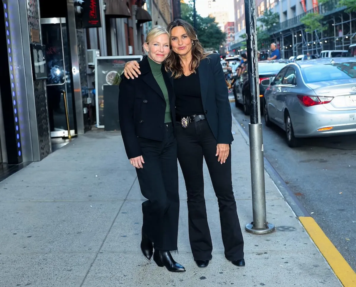 Mariska Hargitay with her arm around Kelli Giddish on the set of 'Law and Order: SVU' Season 26