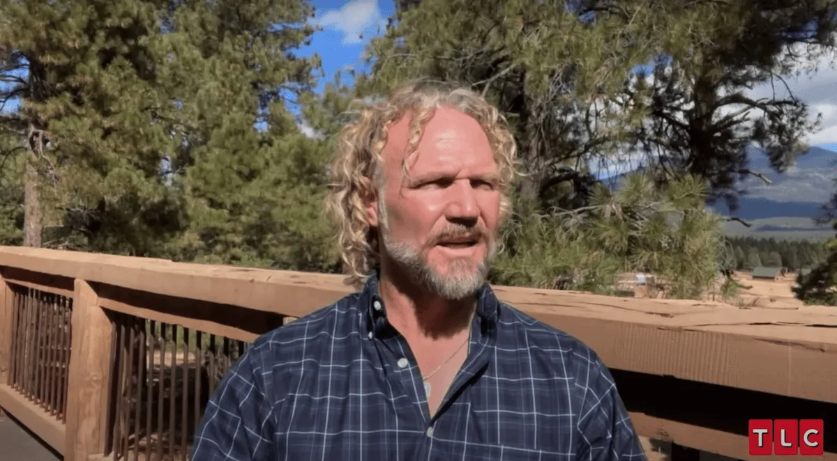 Kody Brown of 'Sister Wives' standing outside on a deck