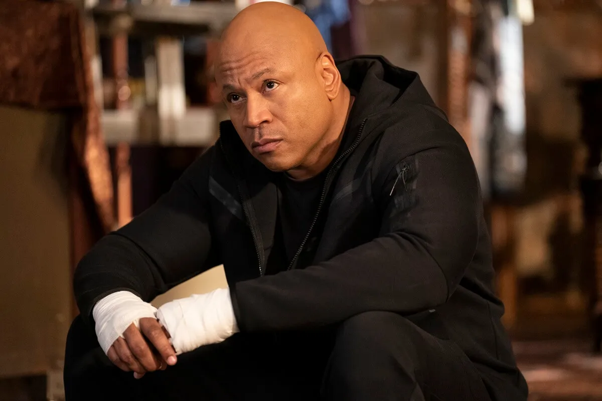 LL Cool J sitting down as his character Sam Hanna in an episode of 'NCIS Los Angeles'.