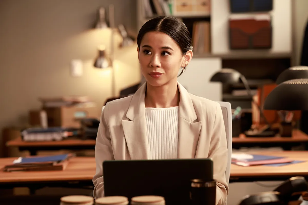 Young woman sitting in front of a tablet in 'Matlock' on CBS