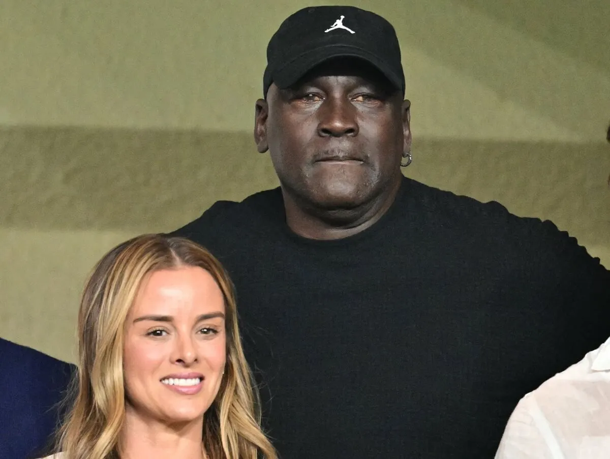 Michael Jordan (C) attends the UEFA Champions League 1st round day 1 football match between AS Monaco and FC Barcelona at the Louis II Stadium