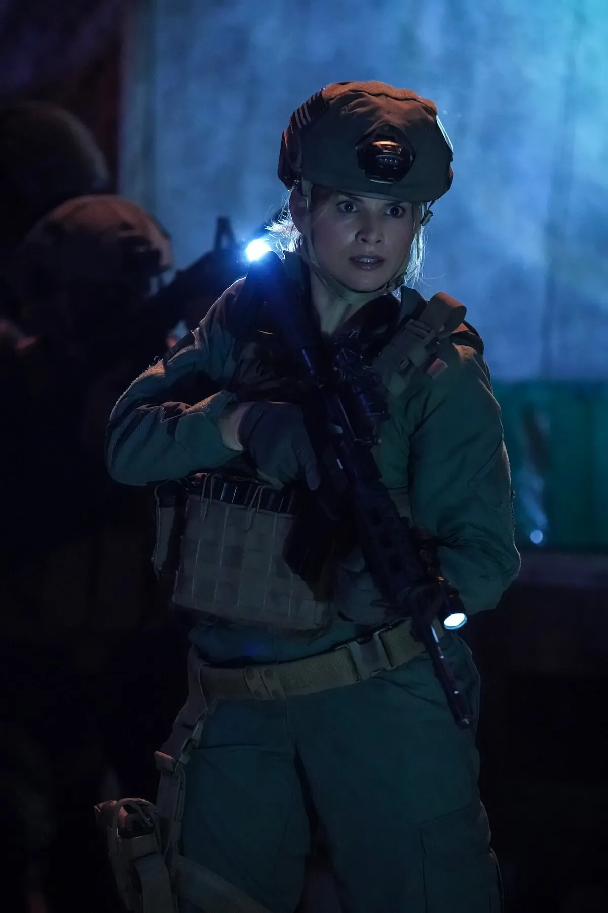 Knight wearing combat gear and holding a gun in 'NCIS' Season 22 premeire