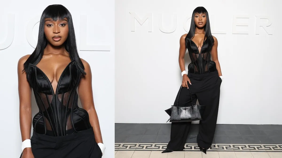 Wearing a black corset and pants, Normani poses for photos before the Mugler fashion show at Paris Fashion Week 2024