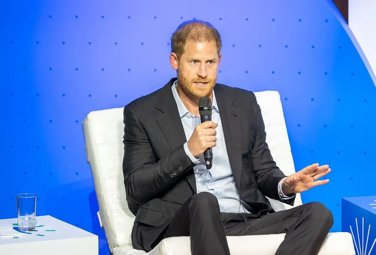 Prince Harry speaks onstage during a forum about digital responsibility at EAN University during a visit around Colombia