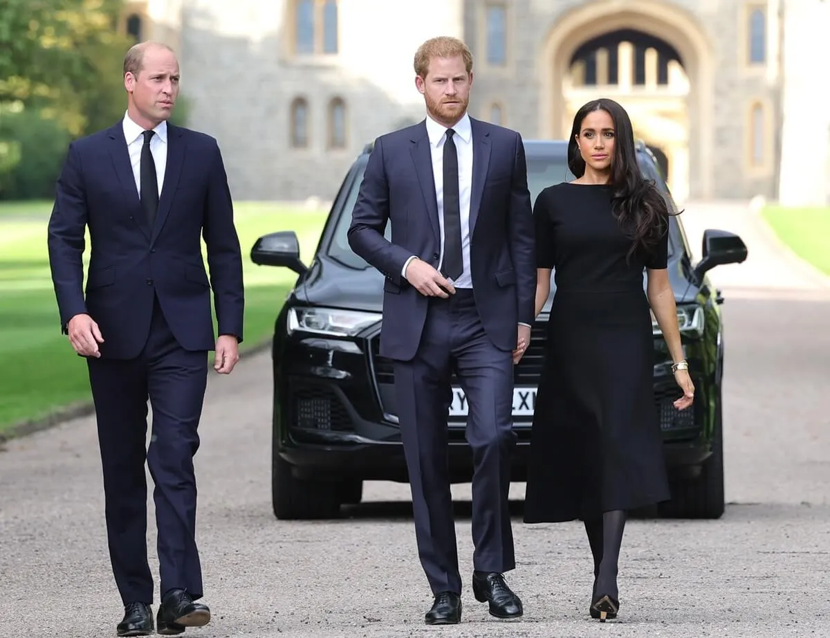 Prince William, Prince Harry, and Meghan Markle on the long Walk at Windsor Castle