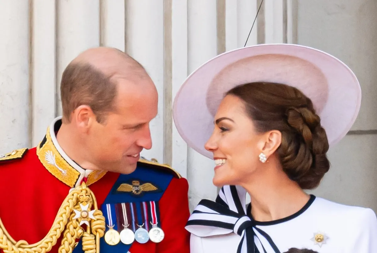 Prince William and Kate Middleton smile at each other on the balcony of Buckingham Palace during Trooping the Colour