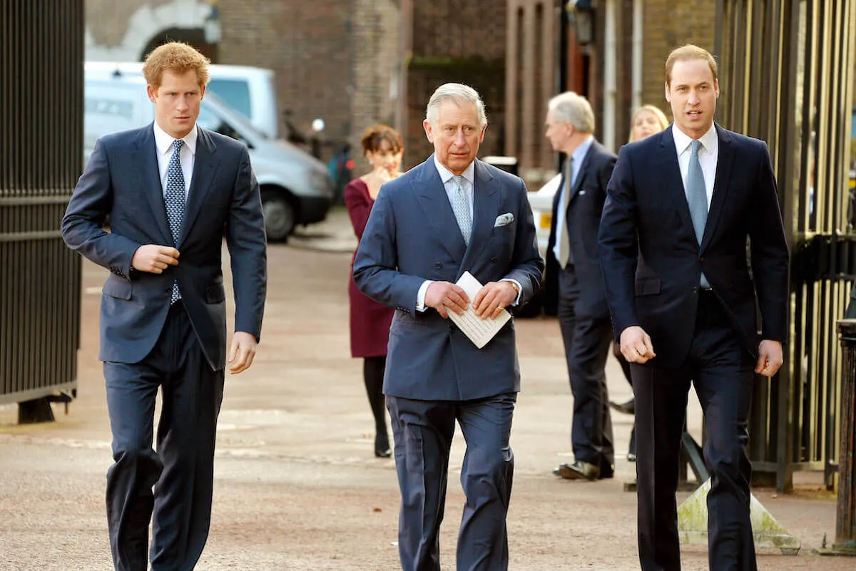 Prince William and King Charles, who wished Prince Harry a happy 40th birthday, with him in 2014