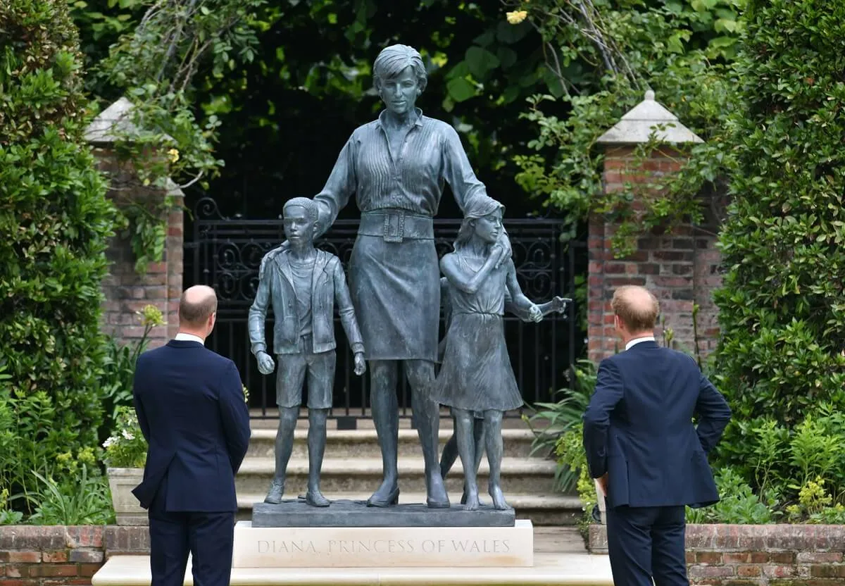 Prince William and Prince Harry after unveiling a statue of their mother Princess Diana in the Sunken Garden at Kensington Palace