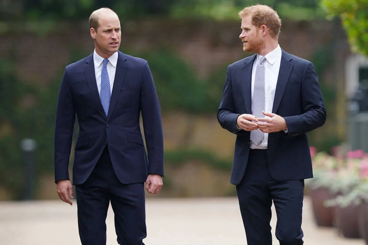 Prince William and Prince Harry, who have a 'glimmer of hope' in rift, walk next to each other in 2021.