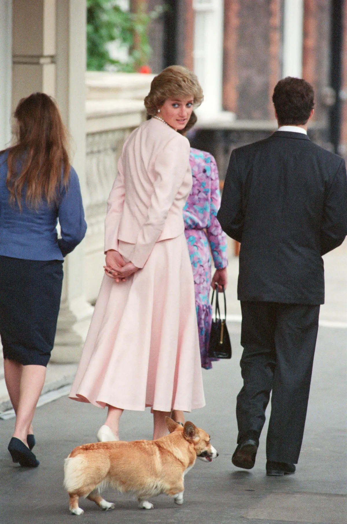 Princess Diana and one of Queen Elizabeth II's corgis