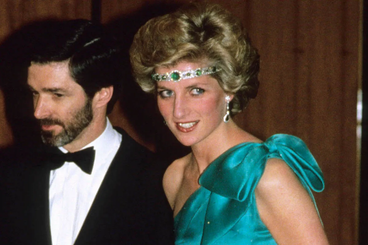 Princess Diana wearing a necklace as a headband after a sunburn