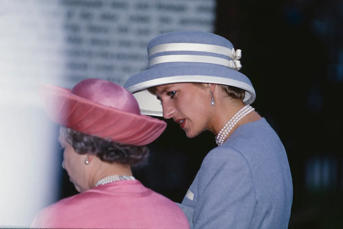 Princess Diana, who didn't like the queen's corgis to be near here, with Queen Elizabeth II