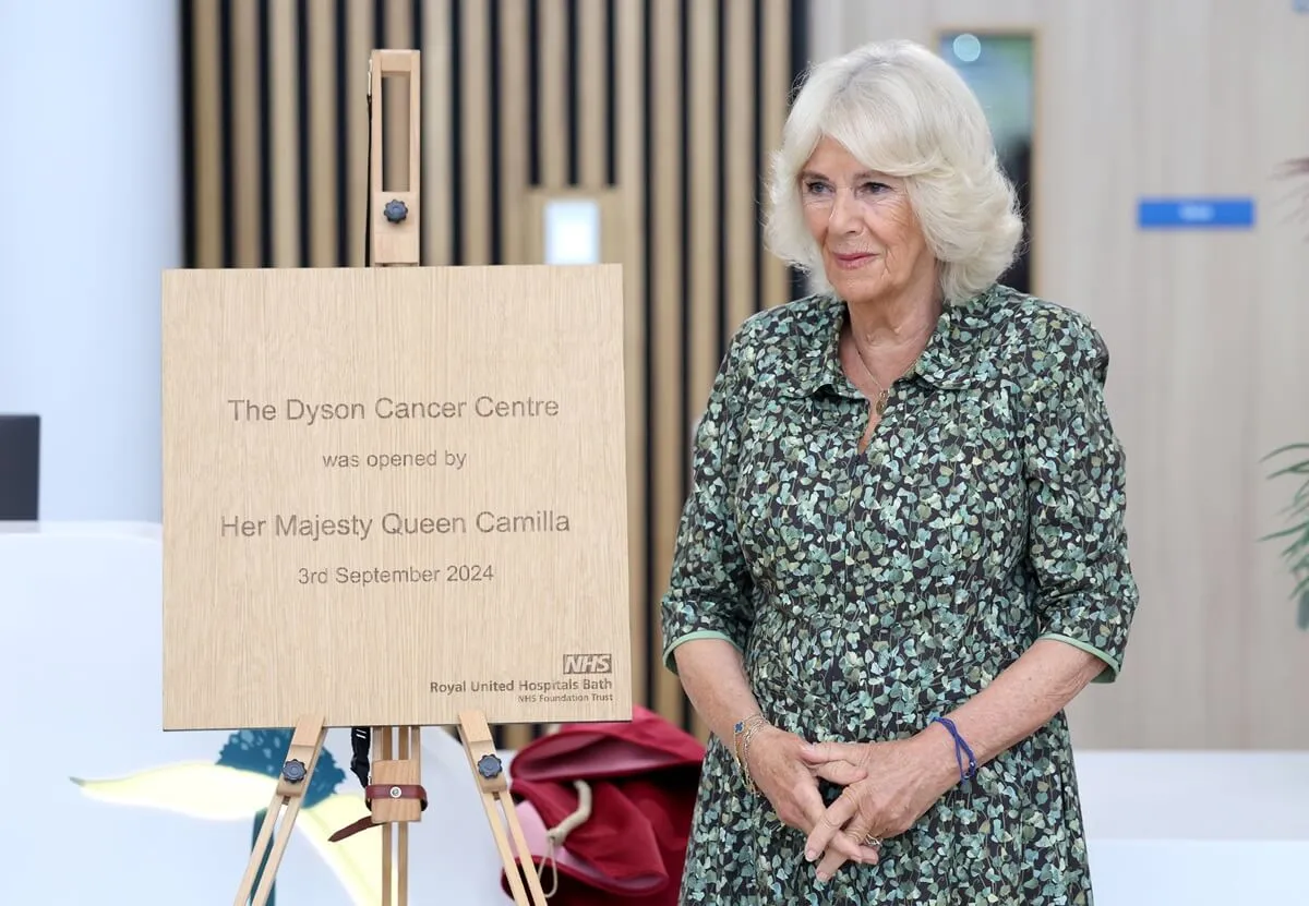 Queen Camilla unveils a plaque at a reception during her visit to the new Dyson Cancer Centre in Bath, England