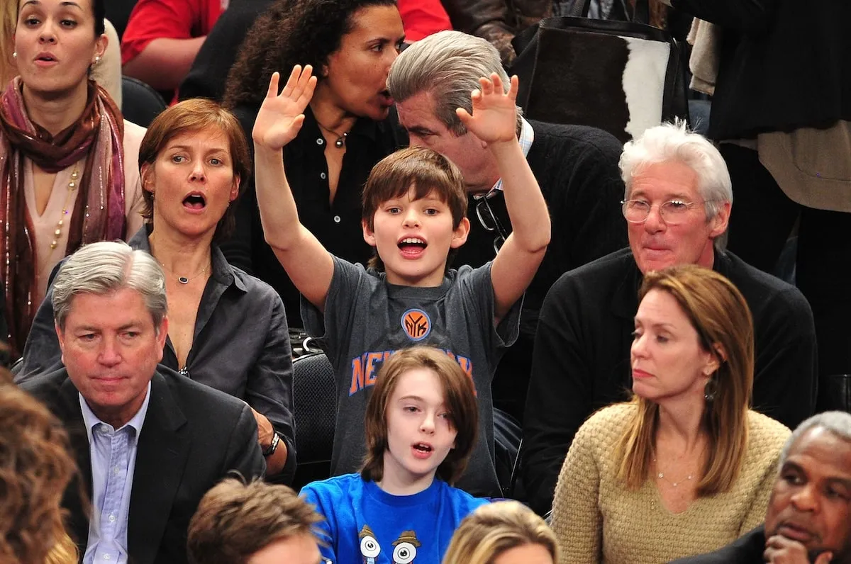 Richard Gere, Carey Lowell, and Homer James Gere cheer for the new York Knicks at Madison Square Garden in 2012