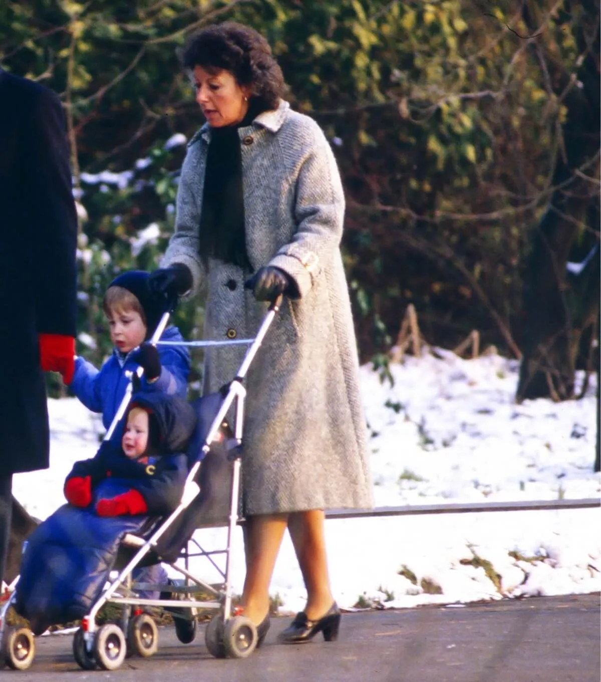 Royal nanny, Barbara Barnes, on a stroll with a young Prince William and Prince Harry in London