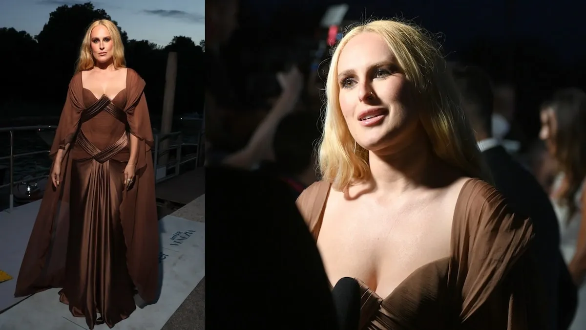 Wearing a bronze draped dress, Rumer Willis speaks to reporters at the amfAR Gala Venezia 2024