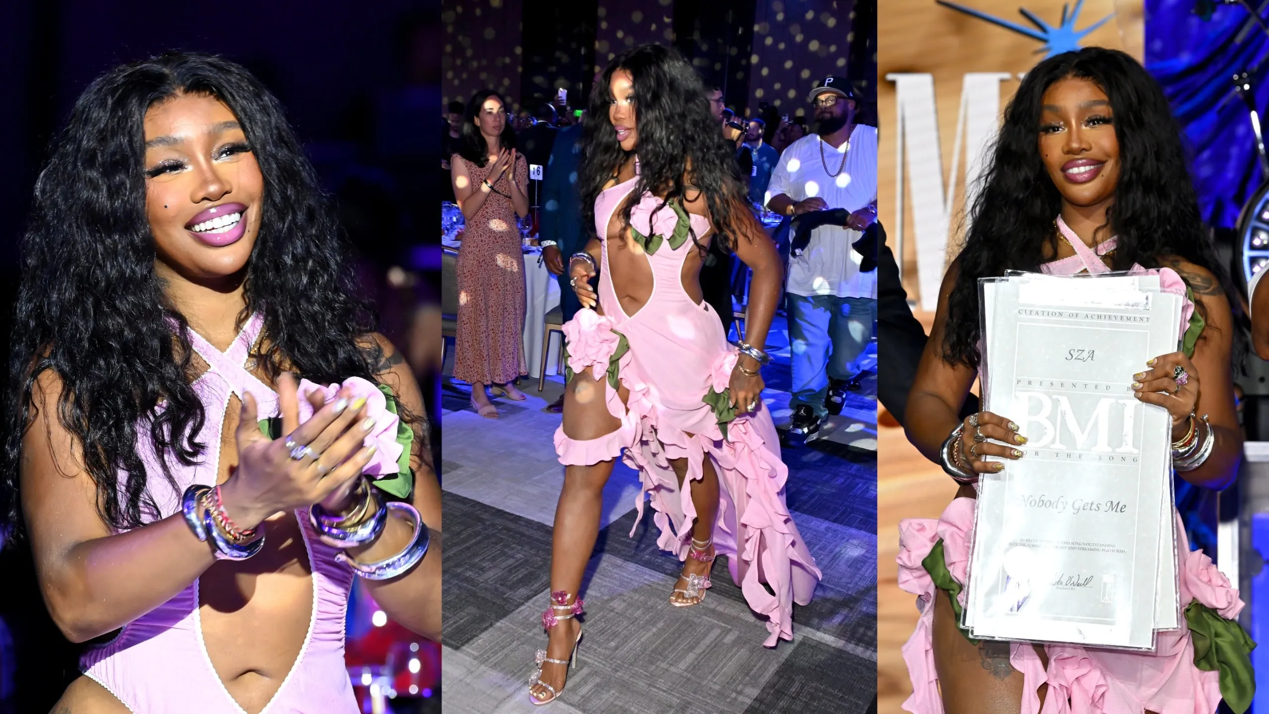 Wearing a pink shredded dress, SZA accepts the BMI Champion Award