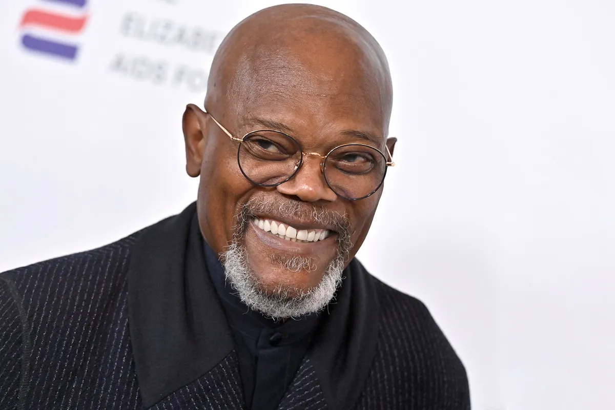 Samuel L. Jackson attends The Elizabeth Taylor Ball to End AIDS at The Beverly Hills Hotel in a black suit.