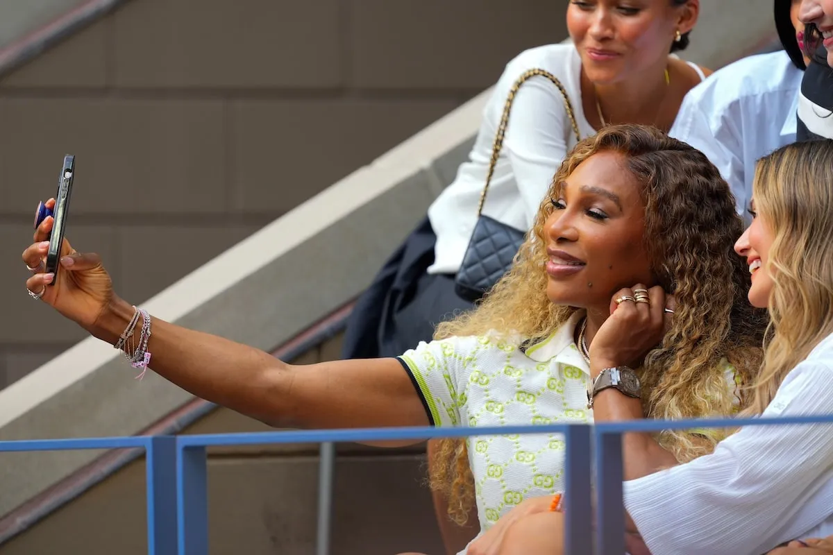 Six-time U.S. Open champion Serena Williams takes a selfie with a fan at Flushing Meadows