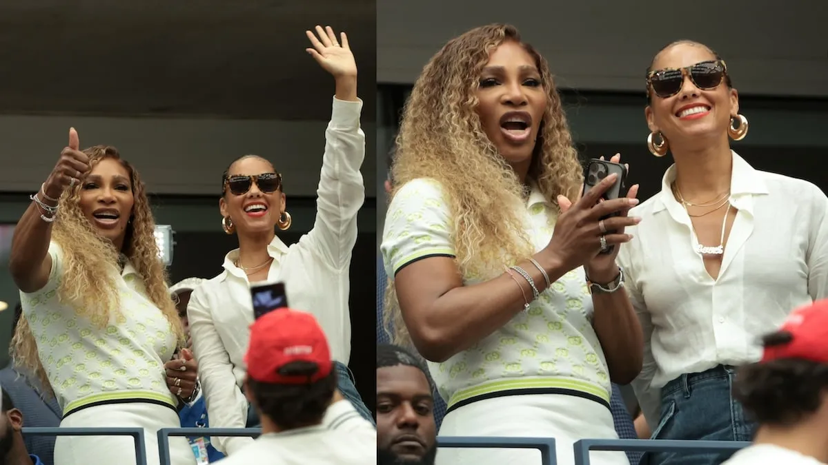 Alicia Keys and Serena Williams stand up next to their seats inside Flushing Meadows and cheer during the U.S. Open