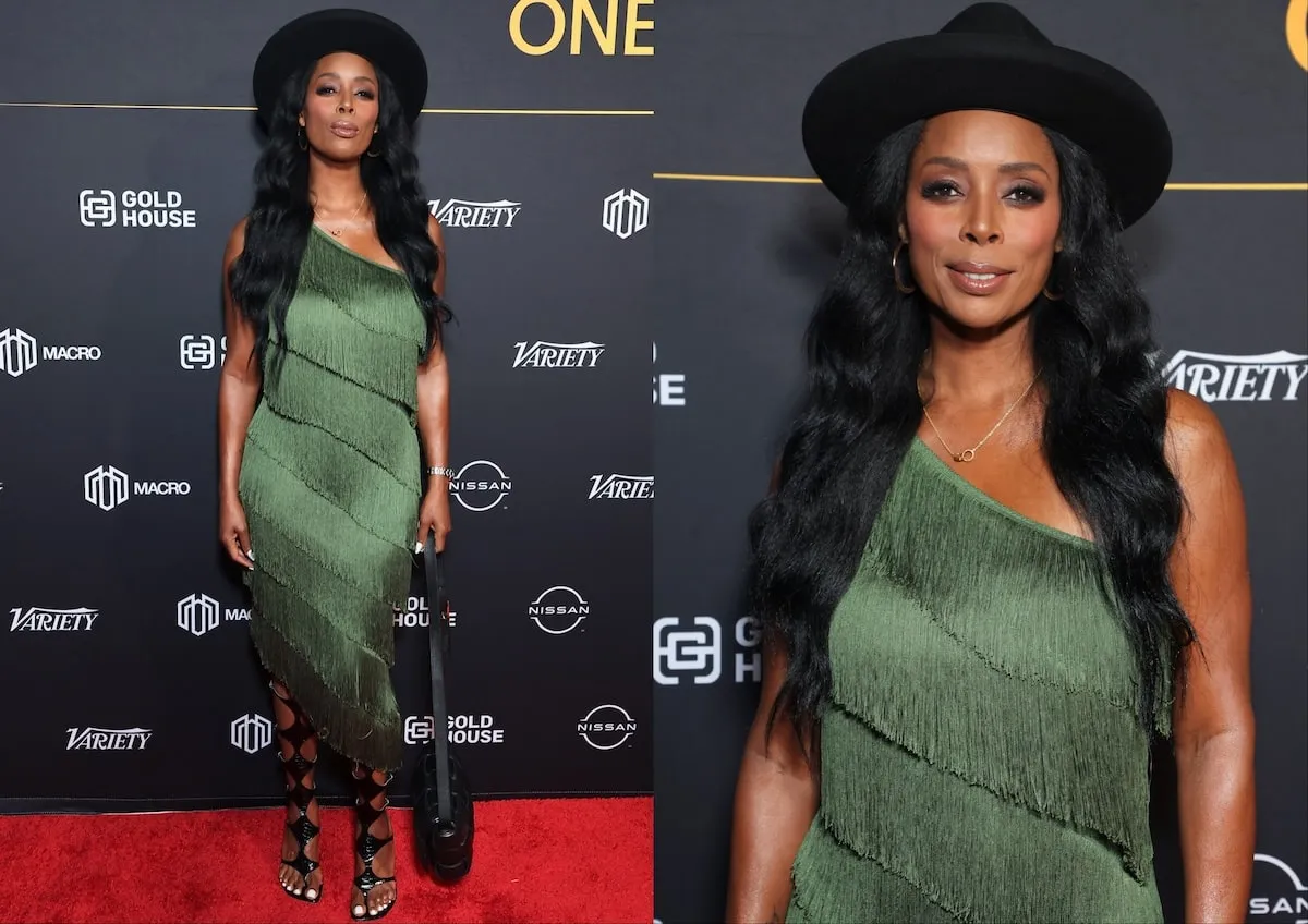 Wearing a green fringed dress, Tasha Smith stands on a red carpet in 2024