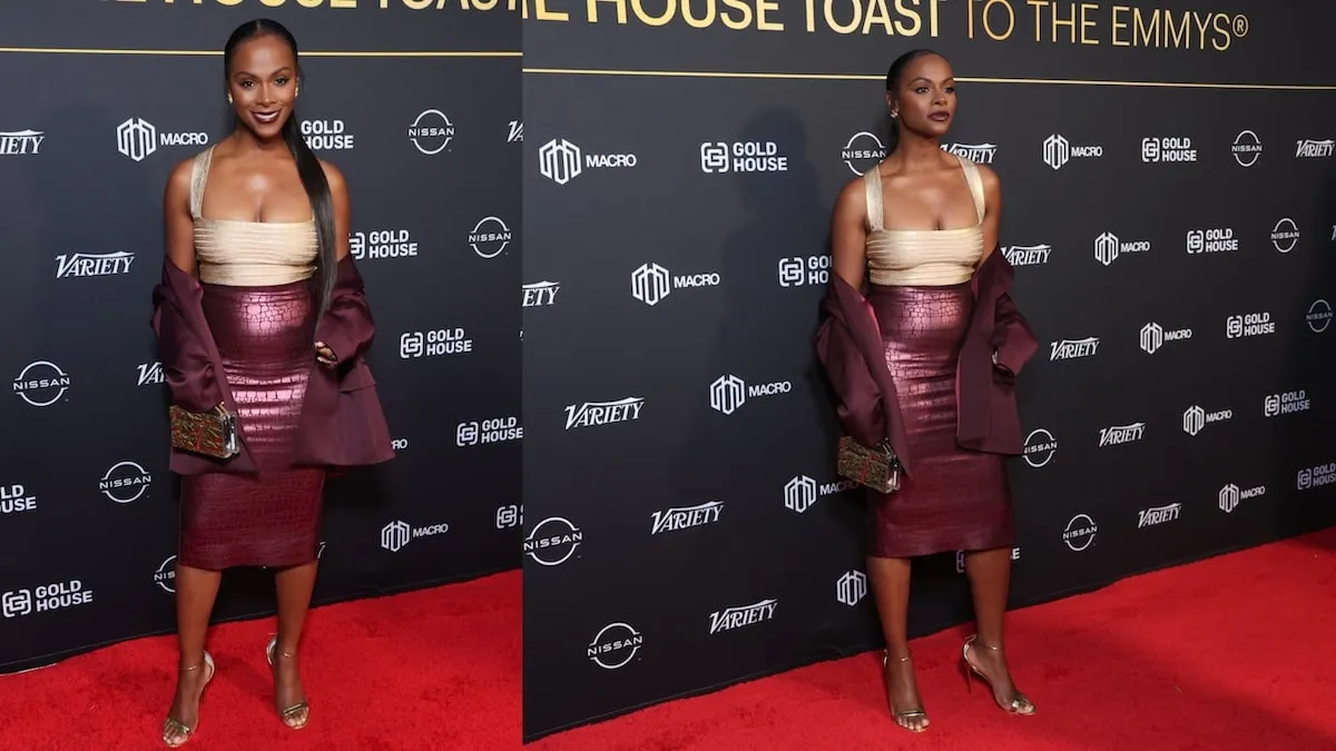 Wearing a gold top and maroon skirt, Tika Sumpter poses for photos at an Emmy party in 2024