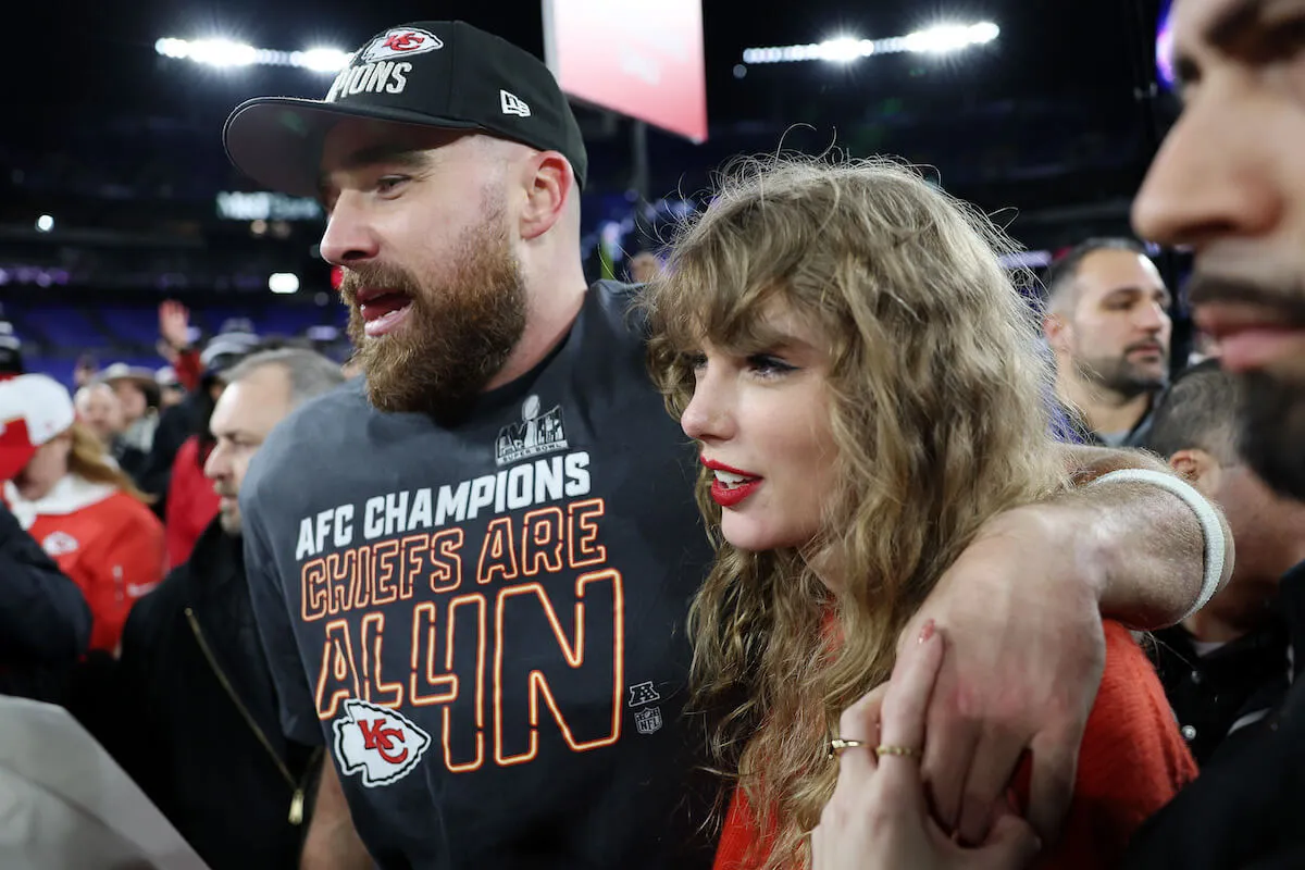 Travis Kelce and Taylor Swift wrap their arms around each other