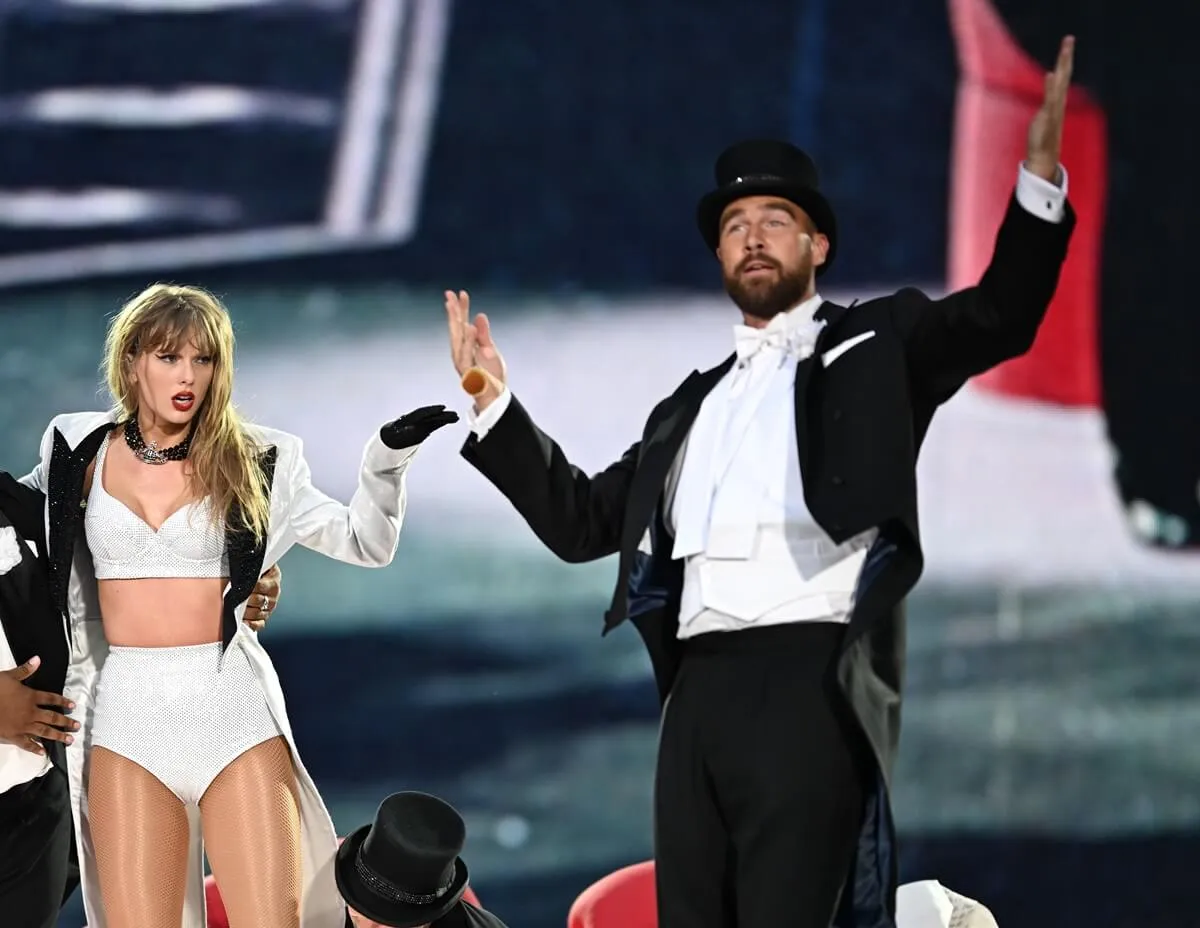 Travis Kelce and Taylor Swift onstage during The Eras Tour at Wembley Stadium in London, England